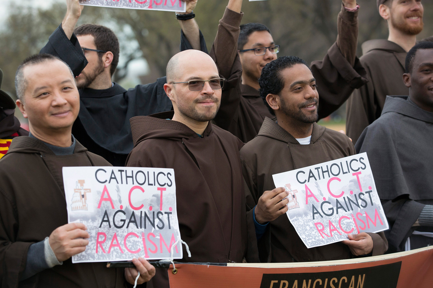 Franciscans hold signs during an “A.C.T. to End Racism” rally on the National Mall in Washington April 4. The rally marked the 50th anniversary of the assassination of civil rights leader the Rev. Martin Luther King Jr.